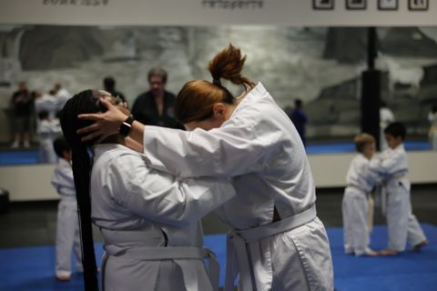 Adult student practicing a kick