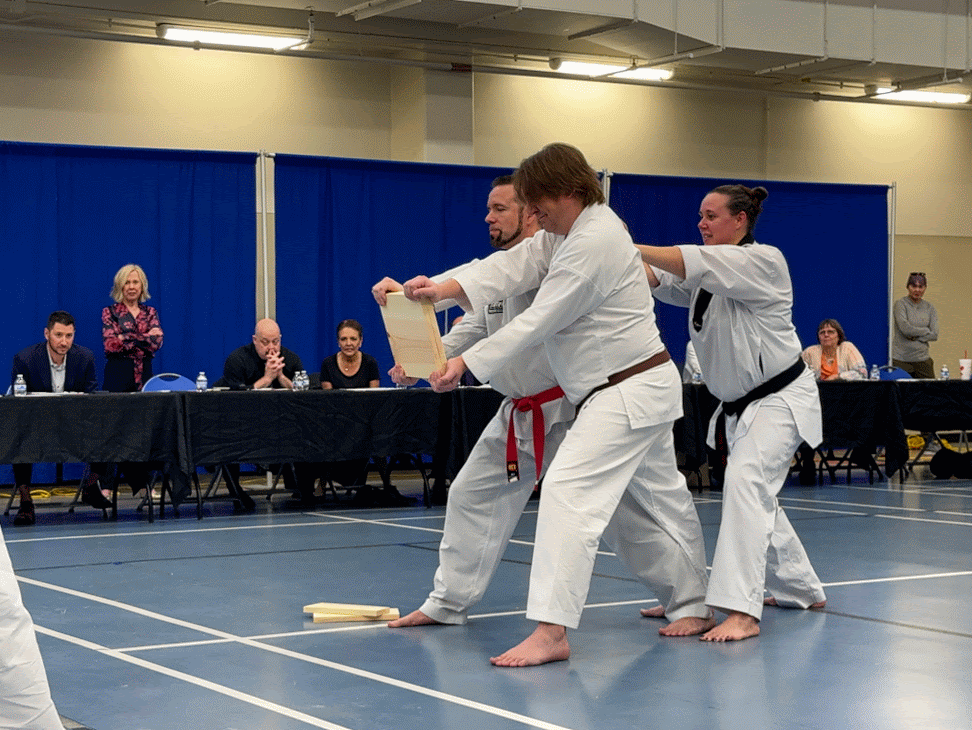 Student breaking boards during a demonstration